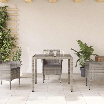 vidaXL Table de jardin avec plateau en verre gris 90x90x75 cm résine tressée
